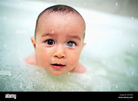 Close Up Portrait Of Baby Boy In Bubble Bath Stock Photo Alamy