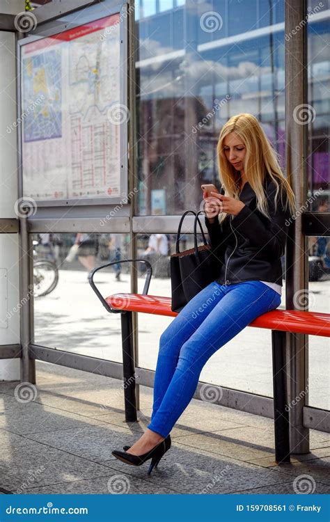An Attractive Young Woman Waiting For The Bus At The Bus Stop Stock Image Image Of Busy