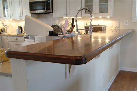 I need to get corbels installed asap, but i have no idea what the standards are for how many i need and how large they have to be for proper support. Walnut Breakfast Bar With Corbels - Maryland Wood Countertops