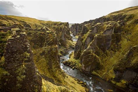 Deep Canyon Steep Cliffs Overgrown With Green Moss Surrounded By A