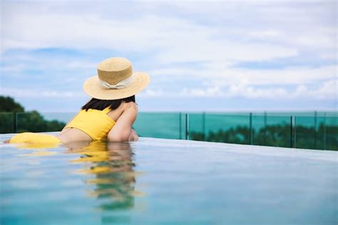 Premium Photo Traveler Asian Woman With Hat And Bikini Relax In