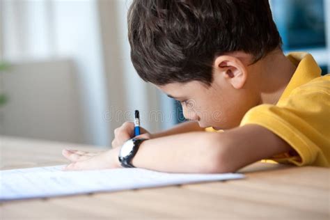 Boy Doing His Homework At Home Stock Photo Image Of Play