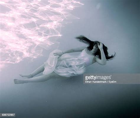 Young Woman Underwater Floating With White Dress Photos And Premium