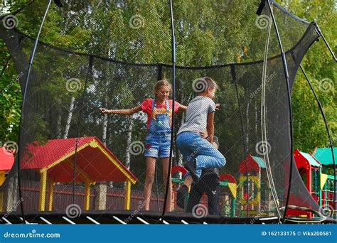 Children Jump On A Trampoline On Summer Stock Image Image Of Child