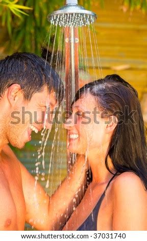 Romantic Lovely Cheerful Positive Showering Couple Under Outdoor Shower