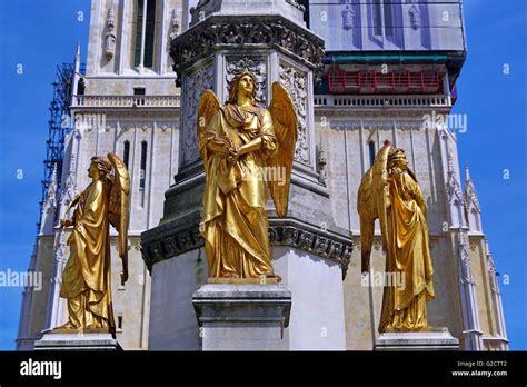 Gold Angel Statue On The Holy Mary Monument Column Beside Zagreb
