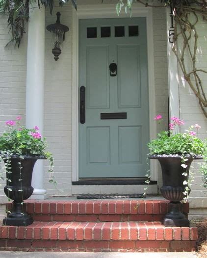 White beach home with a blue shutter front door and blue window shutters. Some Like A Project: Inspiration for Our Front Door