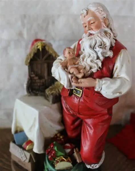Santa Claus Nativity Scene Holding Baby Jesus Statue Centerpiece 8 Inch