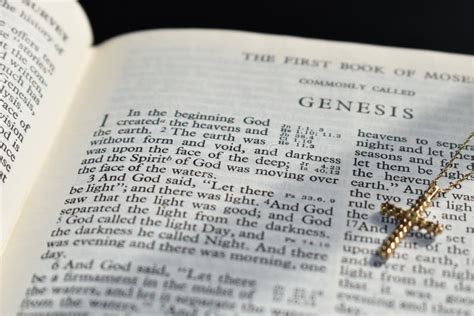 Bible Book Of Genesis Chapter 1 With A Gold Cross Stock Image Image