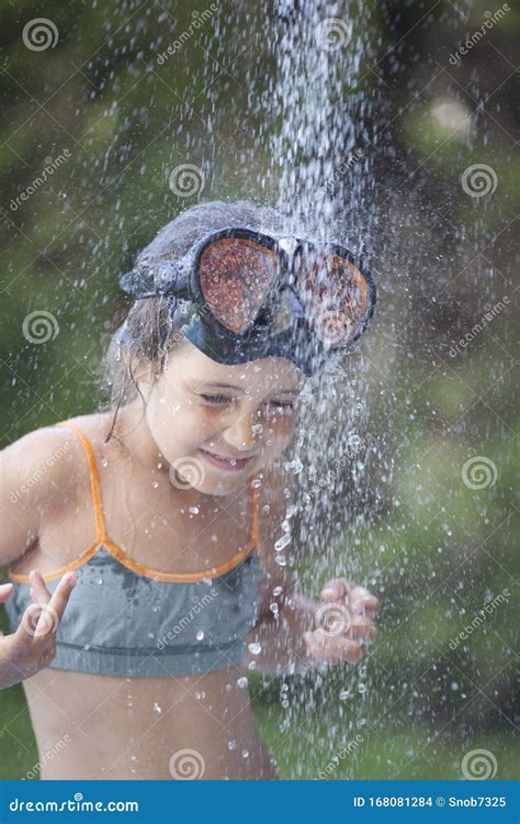 Young And Beautiful Girl In Bikini Taking Bath In A Waterfall Stock