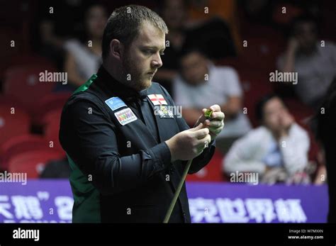 Mark Allen Of Northern Ireland Chalks His Cue As He Considers A Shot To Scotland In A Group D