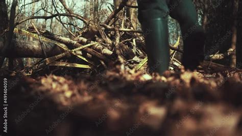 Man Walks Into A Crime Scene In The Woods Taped And Cornered Off Area