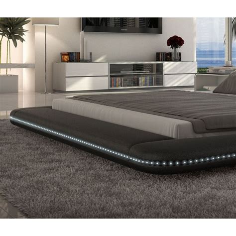 Sits flush on the floor. TOS- INN-CUSTO Black Upholstered Modern Design Low Profile Platform Bed With LED lighting