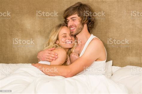 Cute Couple Cuddling In Bed Stock Photo Download Image Now 20 29