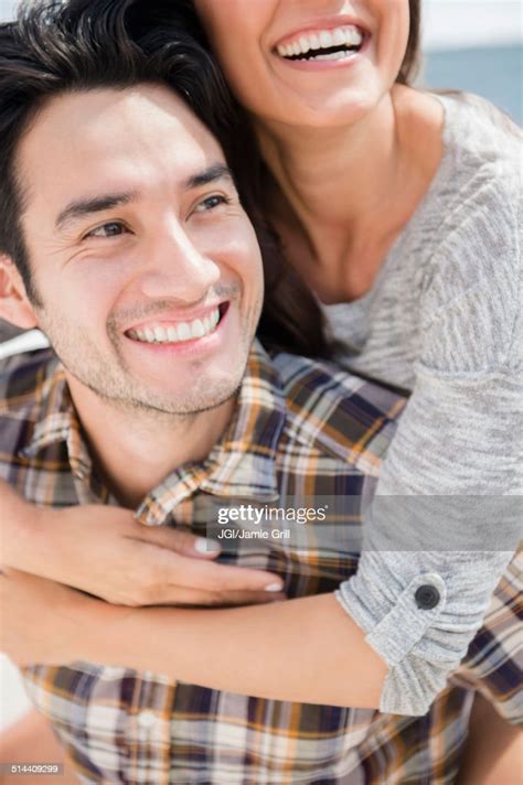 Smiling Couple Hugging High Res Stock Photo Getty Images