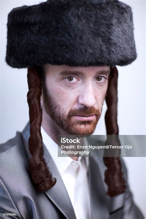 Portrait Of A Young Orthodox Hasdim Jewish Man With Red Beard And Black