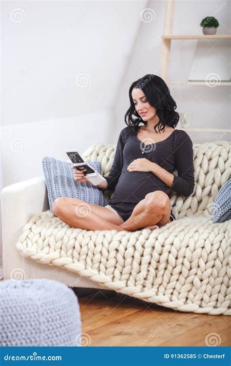 Happy Beautiful Pregnant Woman Relaxing On Sofa With Echo In Hands Stock Image Image Of Echo