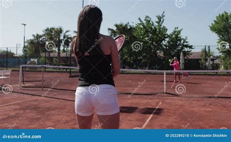 Tennis Two Women Playing Tennis On The Outdoors Court Stock Footage