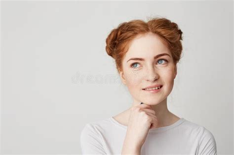 Portrait Of Dreamy Young Pretty Ginger Girl Thinking Dreaming Touching