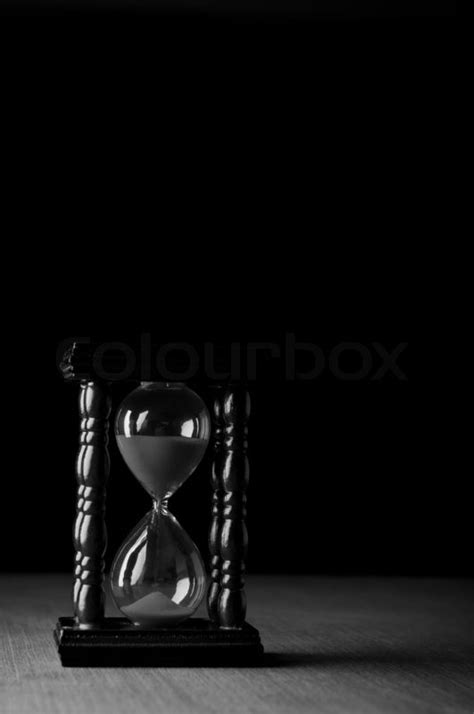 Hourglass Clock On Black Background Stock Image Colourbox
