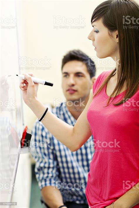 Female Student Writing On Whiteboard Stock Photo Download Image Now