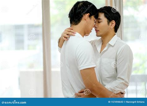 Asian Gay Couple With White Shirt Kiss Together In Bed Room With Day Light Stock Image Image