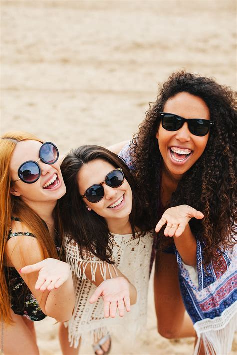 Portrait Of Female Friends Having Fun On The Beach By Stocksy