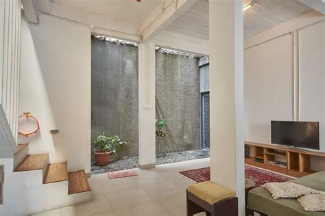 photo livingroom rumah cempaka putih  desain arsitek oleh psa studio