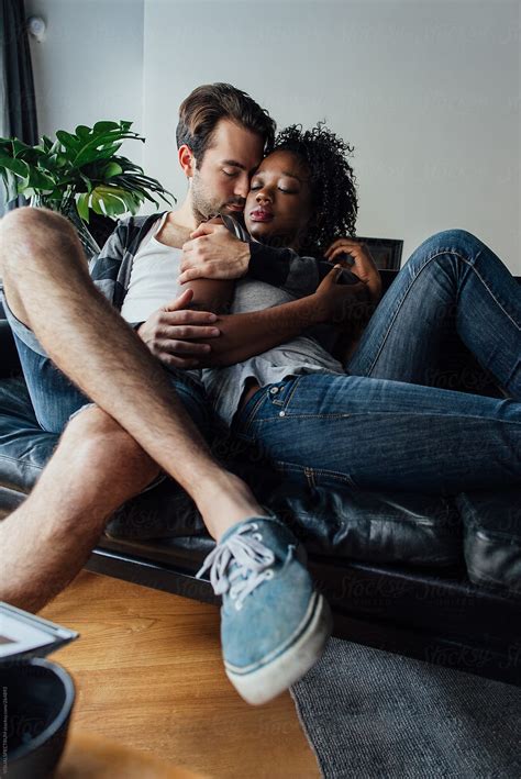 Mixed Race Couple Cuddling By Stocksy Contributor Visualspectrum