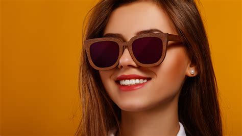 Smiley Girl Model In Orange Background Wearing Coolers Posing For A