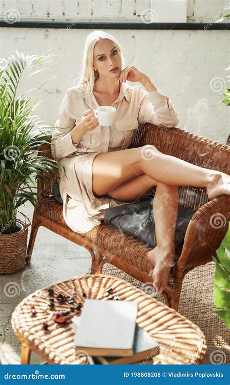 Beautiful Woman Lying Down On Sofa In Hotel Room Stock Photo Image Of