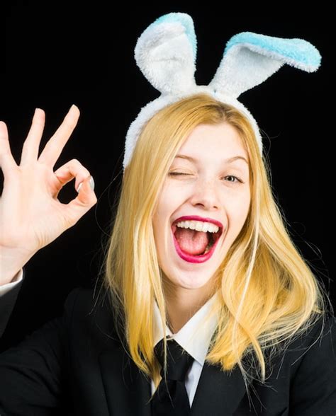 Premium Photo Portrait Of A Happy Woman In Bunny Ears Winking Closeup