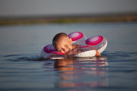 Young Boy Swimming With Floats Stock Image Image Of Sport Security