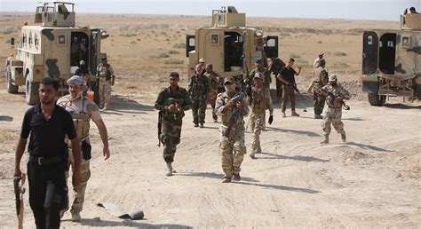 صحف العالم صور تذكارية في العراق على جثث مقاتلي داعش Cnn Arabic