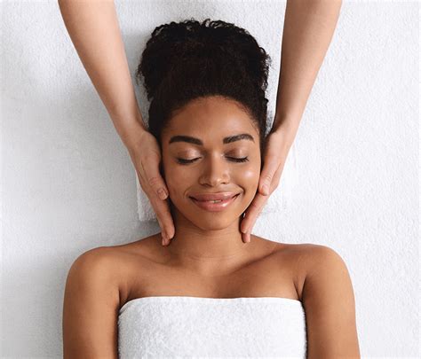 View Of Relaxed Woman Having Facial Massage Beginnings Salon And Day Spa Serving Northeast