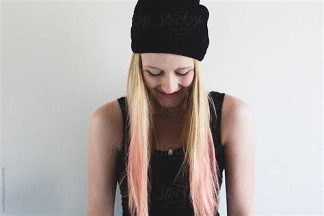 Laughing Teen Girl With Long Blonde And Pink Hair Is Wearing A Black