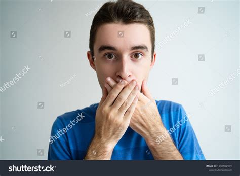 Shocked Man Covering Mouth Both Hands Stock Photo 1198802959 Shutterstock