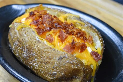 If you wrap the potatoes in foil, the potato skins will shrivel and soften in the oven. Baked Potato - Cook2eatwell