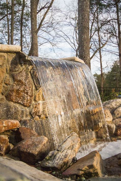 Stone Waterfall Splashing Water From Spa Custom Swimming Pool Feature