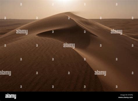 Desert Winds Shift The Sands Atop A Sand Dune In The Middle Of The Rub