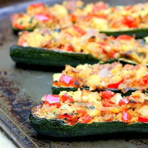 Zucchini halves are filled with ground chicken and provolone cheese, then topped with parmesan cheese creating stuffed zucchini boats the whole family will love. Mix it Up: Stuffed Zucchini Boats