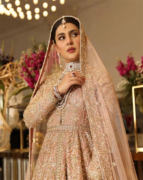 pakistani bridal dress in double layered traditional pishwas frock and pink lehenga style