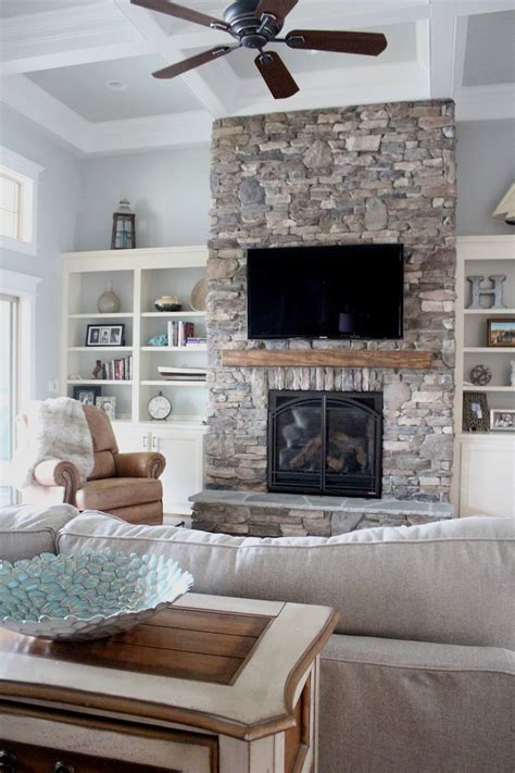 Impressive Rustic Stacked Stone Floor To Ceiling Fireplace — Homebnc