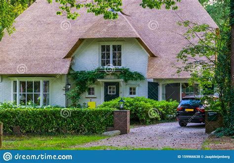 The Front Of A Classical Dutch Home With Driveway Luxurious House In