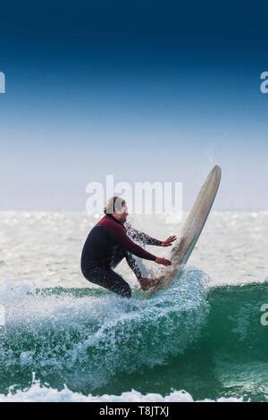 Naked Surfing Nude Surfer On Wave Cornwall UK Stock Photo Alamy