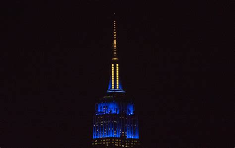 The Empire State Building Is Lit Blue And Yellow In Honor Flickr