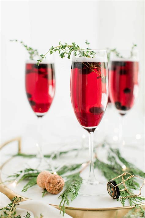 Your champaign christmas stock images are ready. Raise a Glass with these Blueberry and Thyme Champagne Cocktails - The Sweetest Occasion