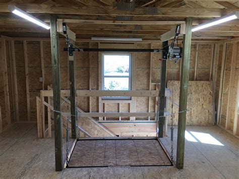 The Attic Lift Is A Garage Lift System That Is Motorized Designed To