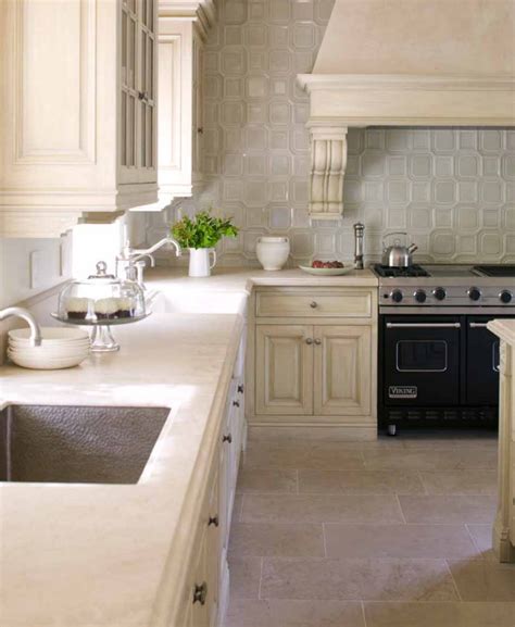 It is decorated with a combination of built in cabinets, walls covered with ceramic the designer has made the best use of every square inch of space. Beautiful Beige Kitchen with Tiled Backsplash ...