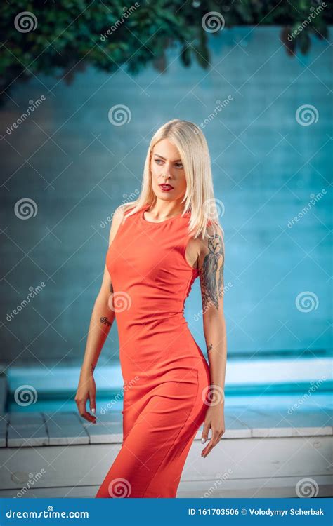 Fashion Outdoor Photo Of Gorgeous Woman With Blond Hair In Luxurious Dress Posing Beside